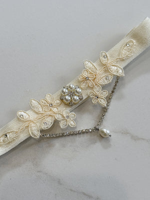 Ivory lace wedding garter with silver crystals and pearls with boho and vintage luxury vibe