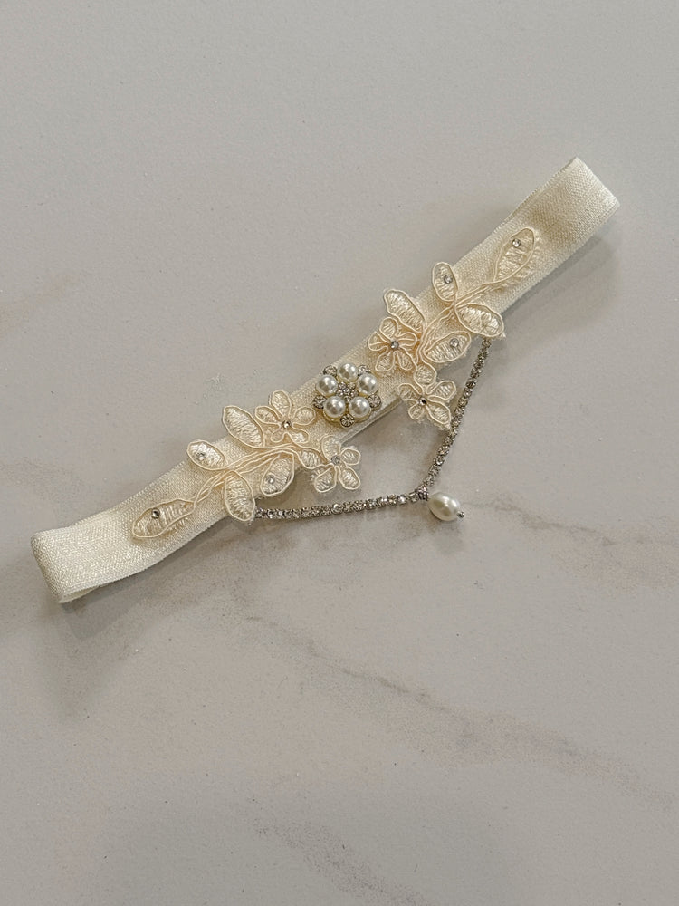 Ivory lace wedding garter with silver crystals and pearls with boho and vintage luxury vibe