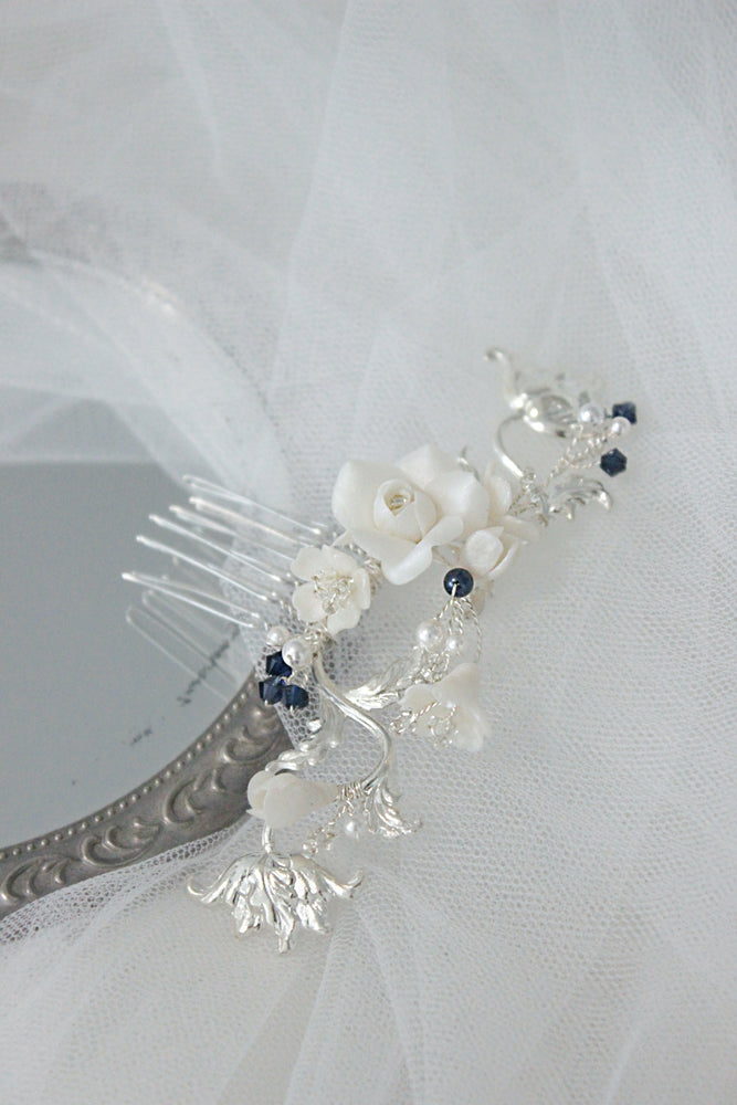 Silver bridal hair comb with roses, flowers, and blue pearls and crystals as something blue