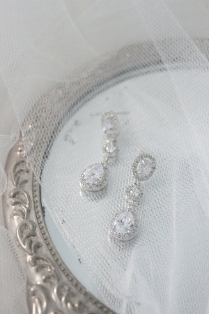 silver crystal long drop bridal earrings on tulle and vintage hand mirror