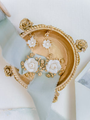 baroque style dolce and gabbana floral gold statement bridal earrings in a gold vintage jewellery trinket box