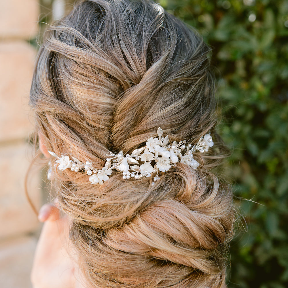 Bridal hair comb for half up half down hairstyle and veil with white flowers, pearls and silver leaves