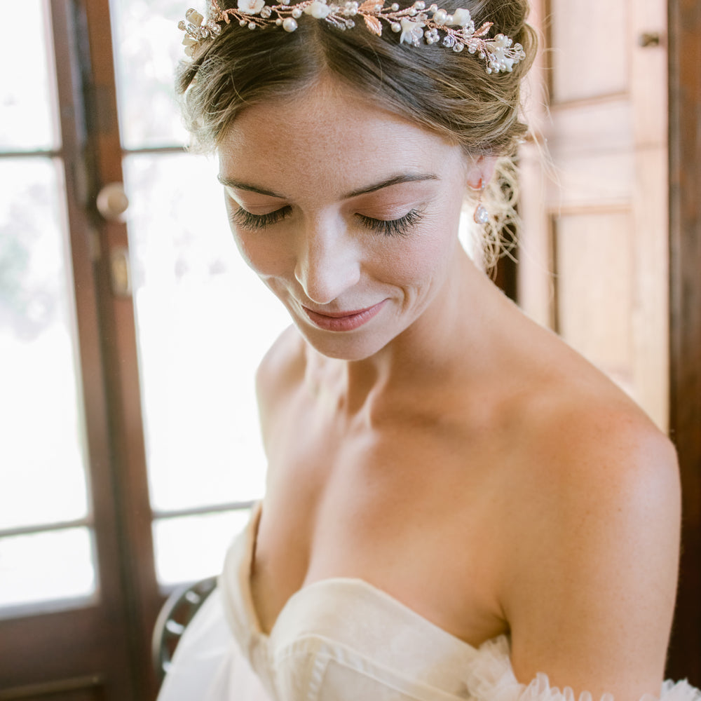Bridal flower crown in rose gold with leaves, pearls and flowers.