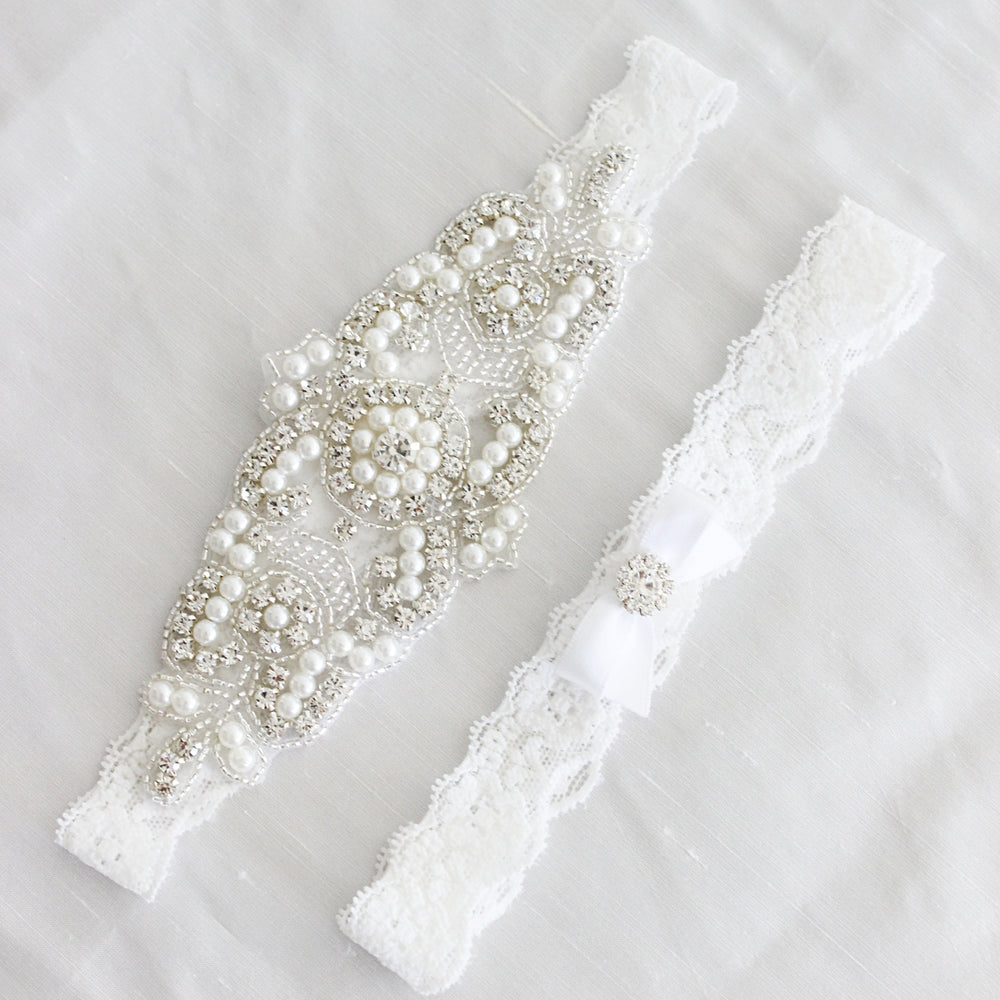 white lace wedding garter, bridal accessories australia, bling crystal pearl wedding garter luxury wedding, luxury garter, lace garter set, crystal bridal garter, white wedding garter, bridal lingerie, bridal boudoir shoot, bow garter, blush underlay wedding gown, white lace garters 